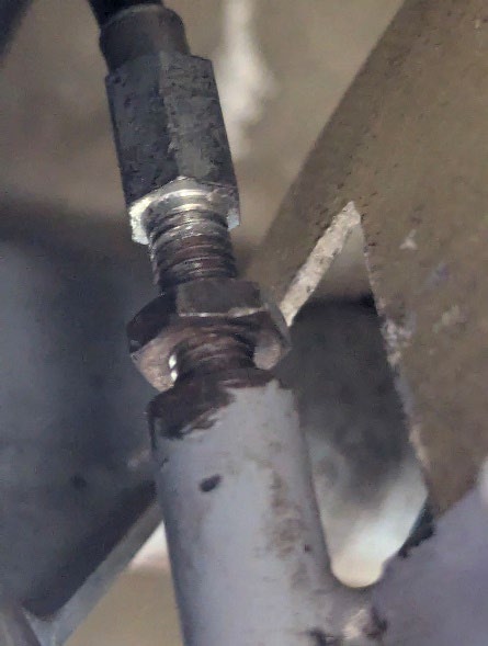 The cable is tight and the lock nut not yet secured